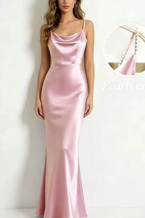 Blush pink satin cowl neck maxi dress with pearl-embellished spaghetti straps.