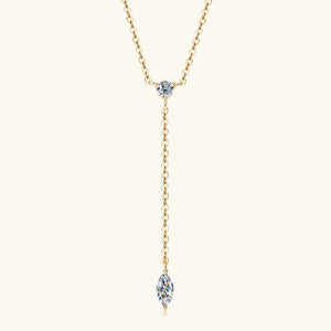 Gold lariat necklace with round and marquise moissanite pendants.