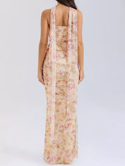 Flowy maxi skirt set with sweetheart tube top in a floral print, featuring a draped scarf detail.
