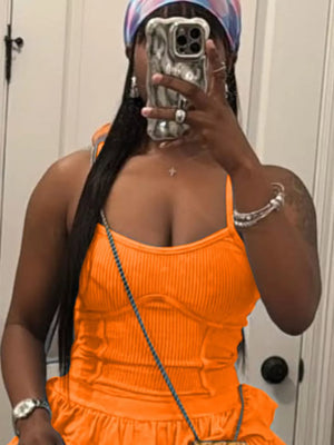 Orange scoop neck cami with ruffled skirt ensemble, ribbed knit detail.