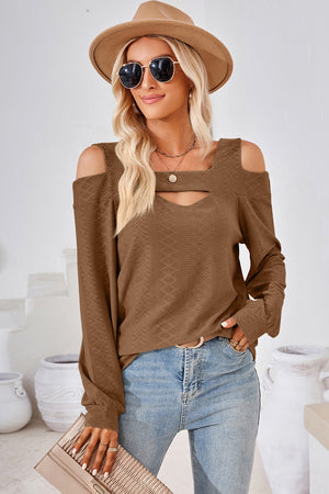 Brown geometric cutout shoulder top with long sleeves and a square neckline.