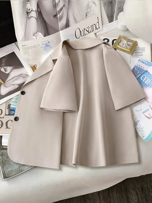 Light khaki short-sleeve tailored blazer jacket with a relaxed fit and two black buttons.