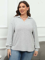 Relaxed ribbed polo top in grey with a collared neckline and long sleeves.