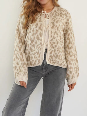 Khaki leopard print tie-front cropped cardigan with long sleeves.
