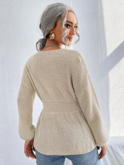Peplum knit sweater in caramel with a scallop neckline and cinched waist.