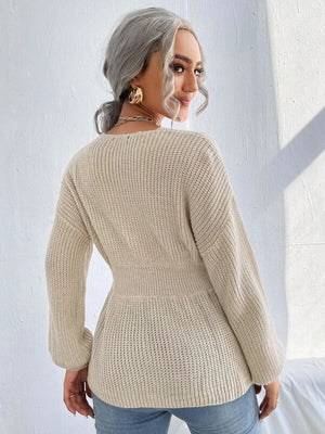 Peplum knit sweater in caramel with a scallop neckline and cinched waist.