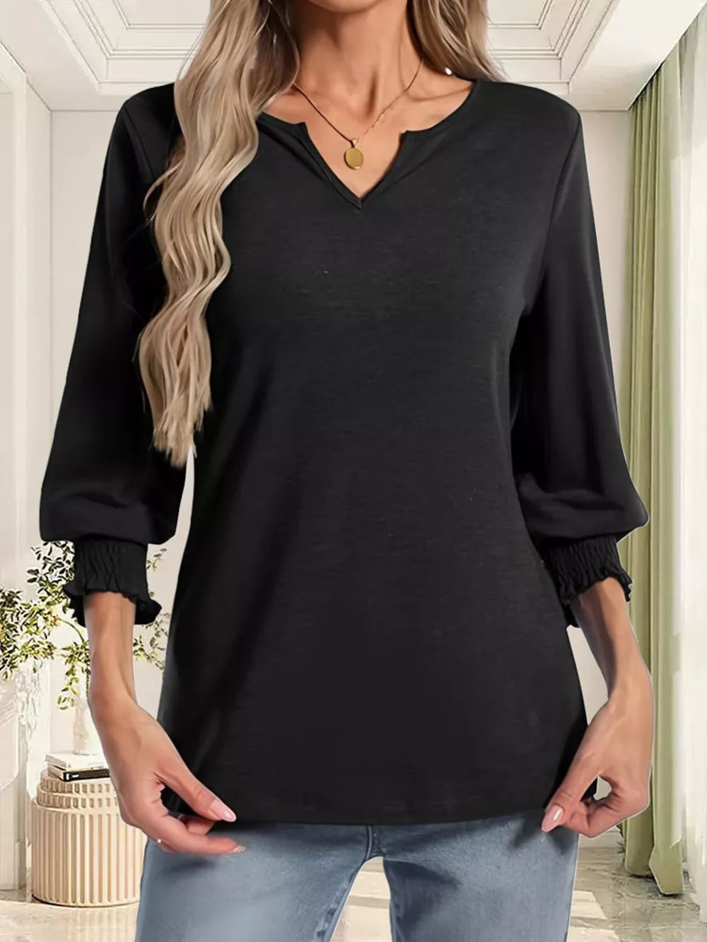 Black maternity t-shirt with notched neckline and ruched 3/4 sleeves.