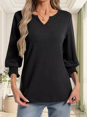 Black maternity t-shirt with notched neckline and ruched 3/4 sleeves.