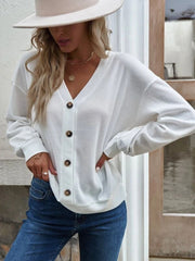 White waffle knit button-down cardigan with V-neck and brown buttons