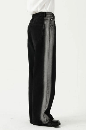 Dark wide leg jeans with faded side panels and a relaxed fit.