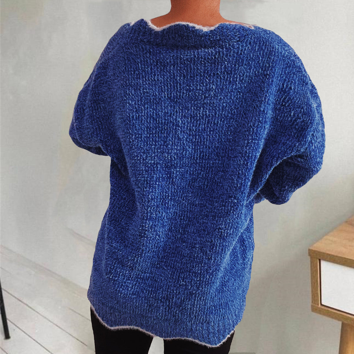 Royal blue knit sweater with scalloped trim and short sleeves.