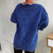 Royal blue knit sweater with scalloped trim and short sleeves.