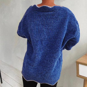 Royal blue knit sweater with scalloped trim and short sleeves.