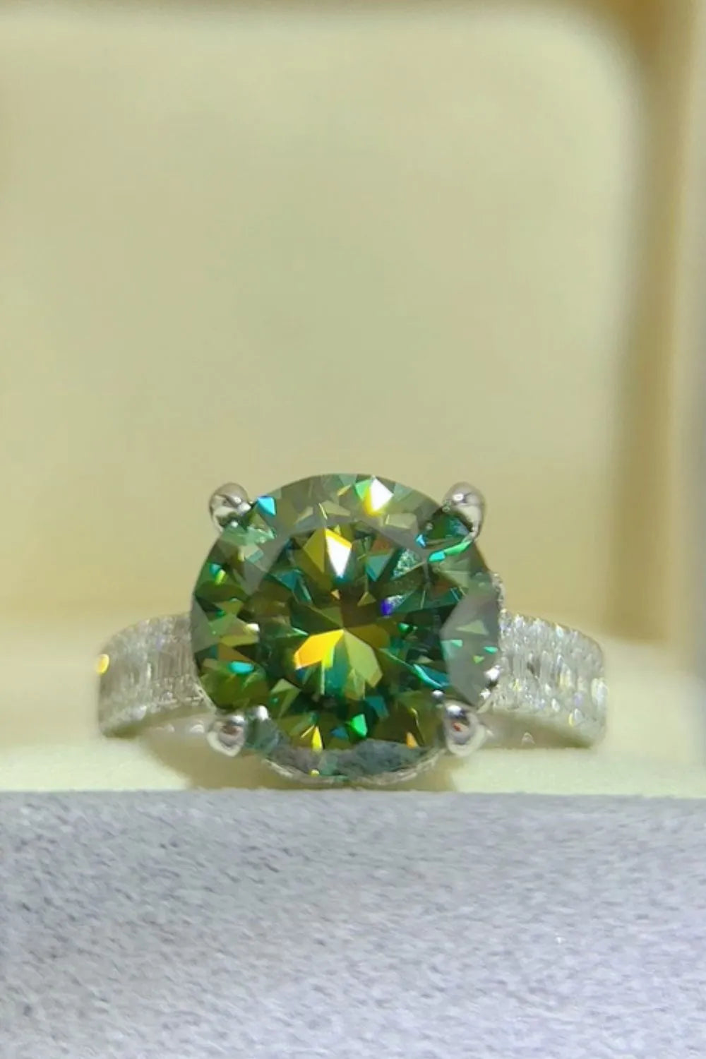 Emerald cut halo engagement ring in dark green sterling silver with pave band.