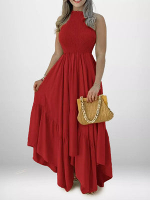 Deep Red smocked halter maxi dress with ruffle hem and flowing skirt.