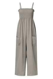 Gray smocked bodice palazzo jumpsuit with wide legs and side pockets.