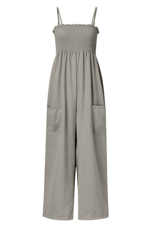 Gray smocked bodice palazzo jumpsuit with wide legs and side pockets.