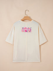 Cream cotton t-shirt with floral chenille patch detail and crew neck.
