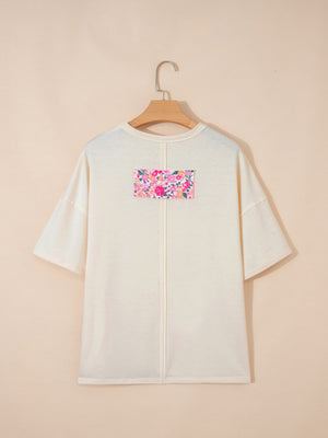 Cream cotton t-shirt with floral chenille patch detail and crew neck.