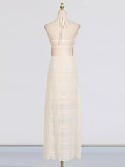 Textured halter neck maxi dress in ivory with sheer back and tiered skirt.