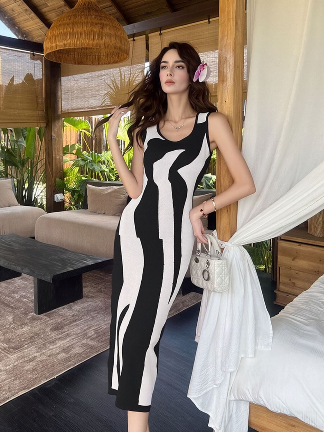 Black and white abstract pattern bodycon midi dress with scoop neck and sleeveless design.