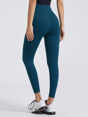 Teal FlexFit wideband leggings with a high waist and 7/8 length shown from the back.