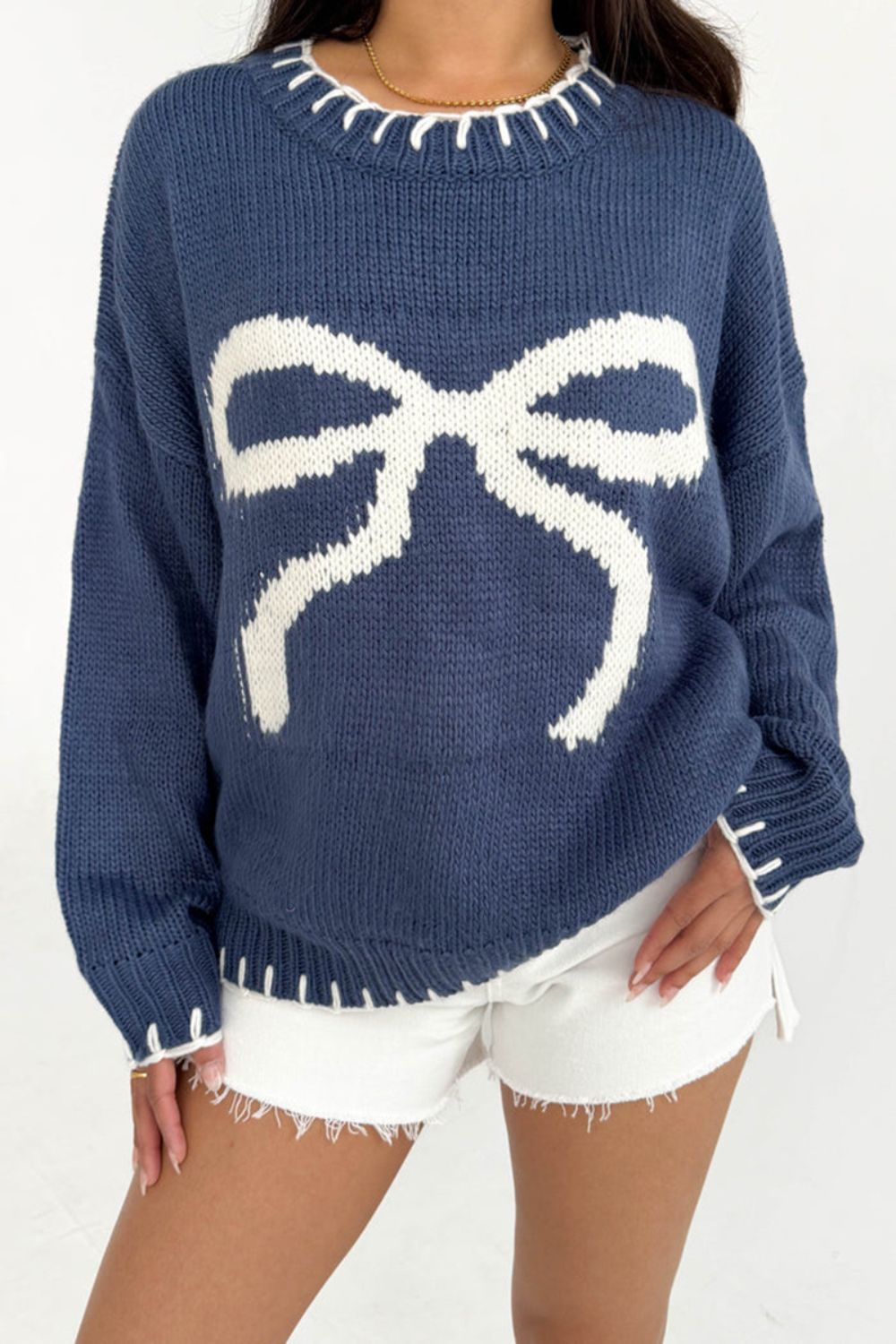 Dusty Blue knit crewneck sweater with white bow graphic and contrast stitching