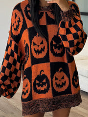 Checkerboard pumpkin knit sweater with balloon sleeves in ochre and black.