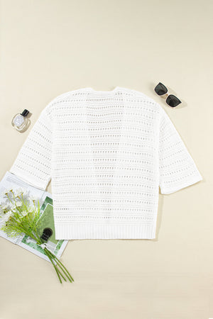 White open-knit dolman sleeve cardigan with a relaxed fit and breathable acrylic material.