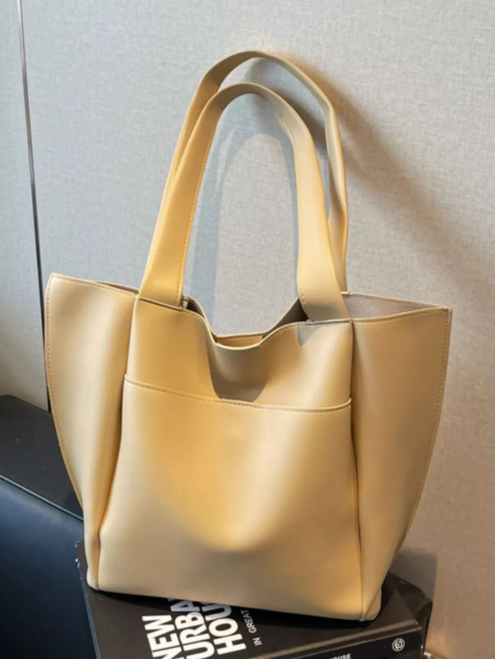 Khaki pu leather tote bag with two top handles and front pocket detail