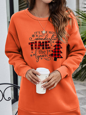 Orange tunic sweatshirt with holiday graphic and buffalo plaid Christmas tree.