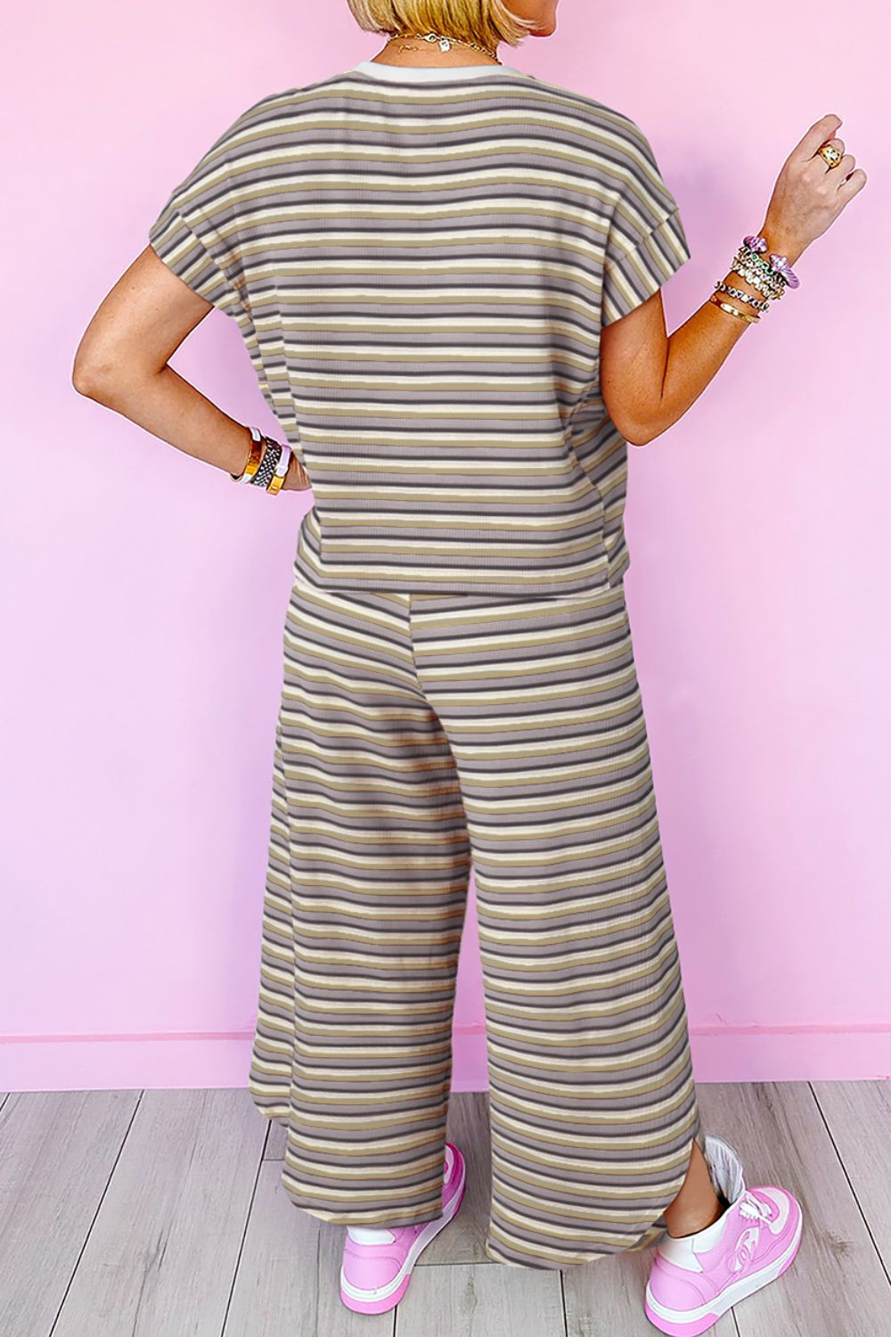 Cotton culotte jumpsuit with rainbow stripes and drawstring waist.