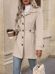 Camel button-up trench coat with cinched waist and button details.