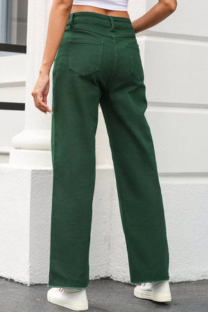 Green cotton straight-leg jeans with a crossed v-waist and frayed hem.