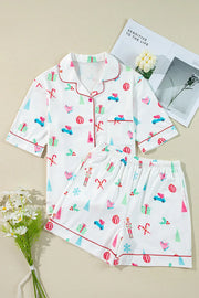 White cotton pajama set with festive Christmas print and contrast piping.