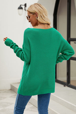 Green knit sweater with boat neck and distressed details, acrylic material.