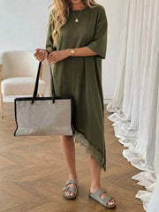 Army green asymmetrical t-shirt dress with lace trim detail and short sleeves.