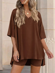 Brown V-neck two-piece set with oversized top and biker shorts.