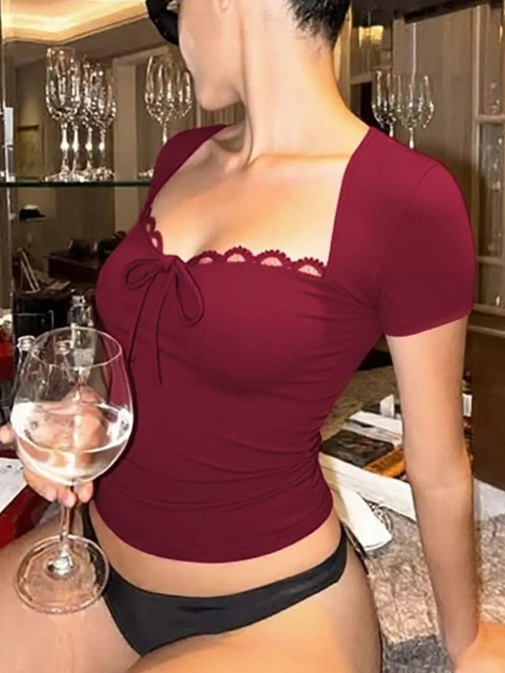 Wine red tie-front t-shirt with lace trim and square neckline.