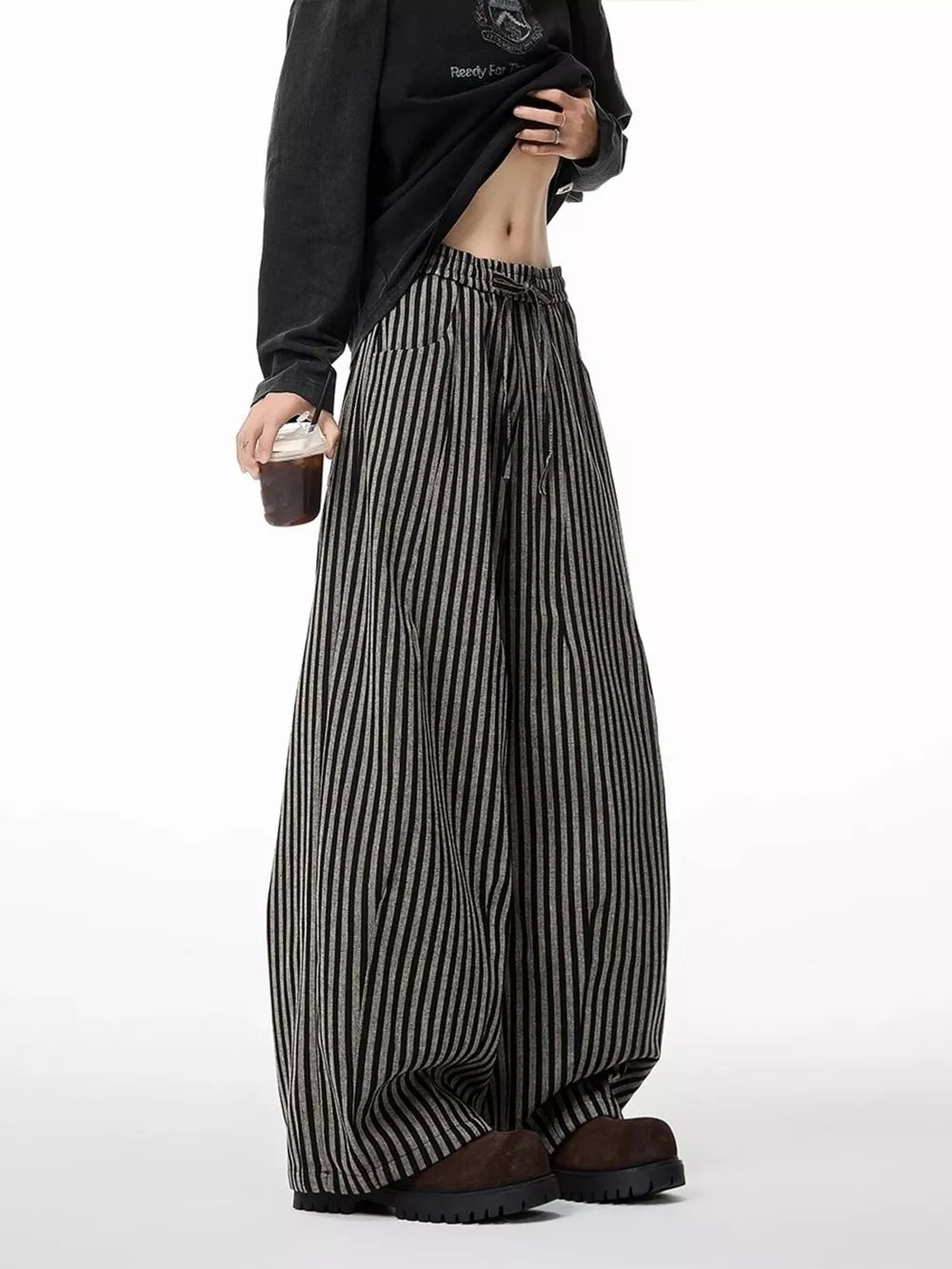 Striped wide-leg sweatpants in black with a drawstring waist.