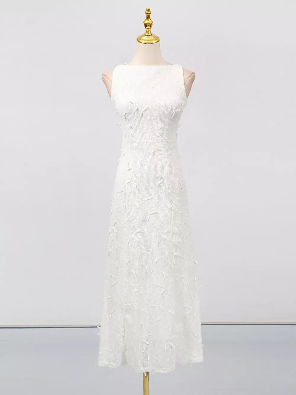 White midi dress with floral applique, boat neck, and a-line cut.