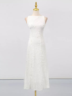 White midi dress with floral applique, boat neck, and a-line cut.