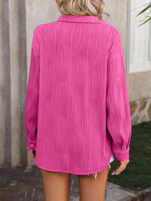 Hot Pink textured pleat oversized button-down shirt with long sleeves and collar.
