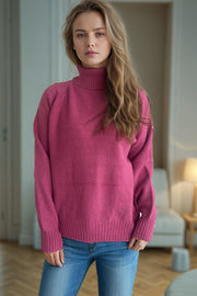 Speckled Donegal turtleneck pullover in blush pink acrylic with ribbed cuffs and hem.