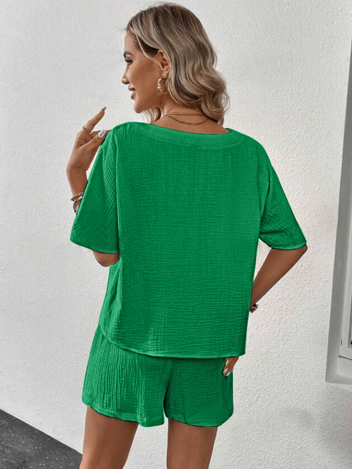 Green textured gauze lounge set with short sleeves and shorts.