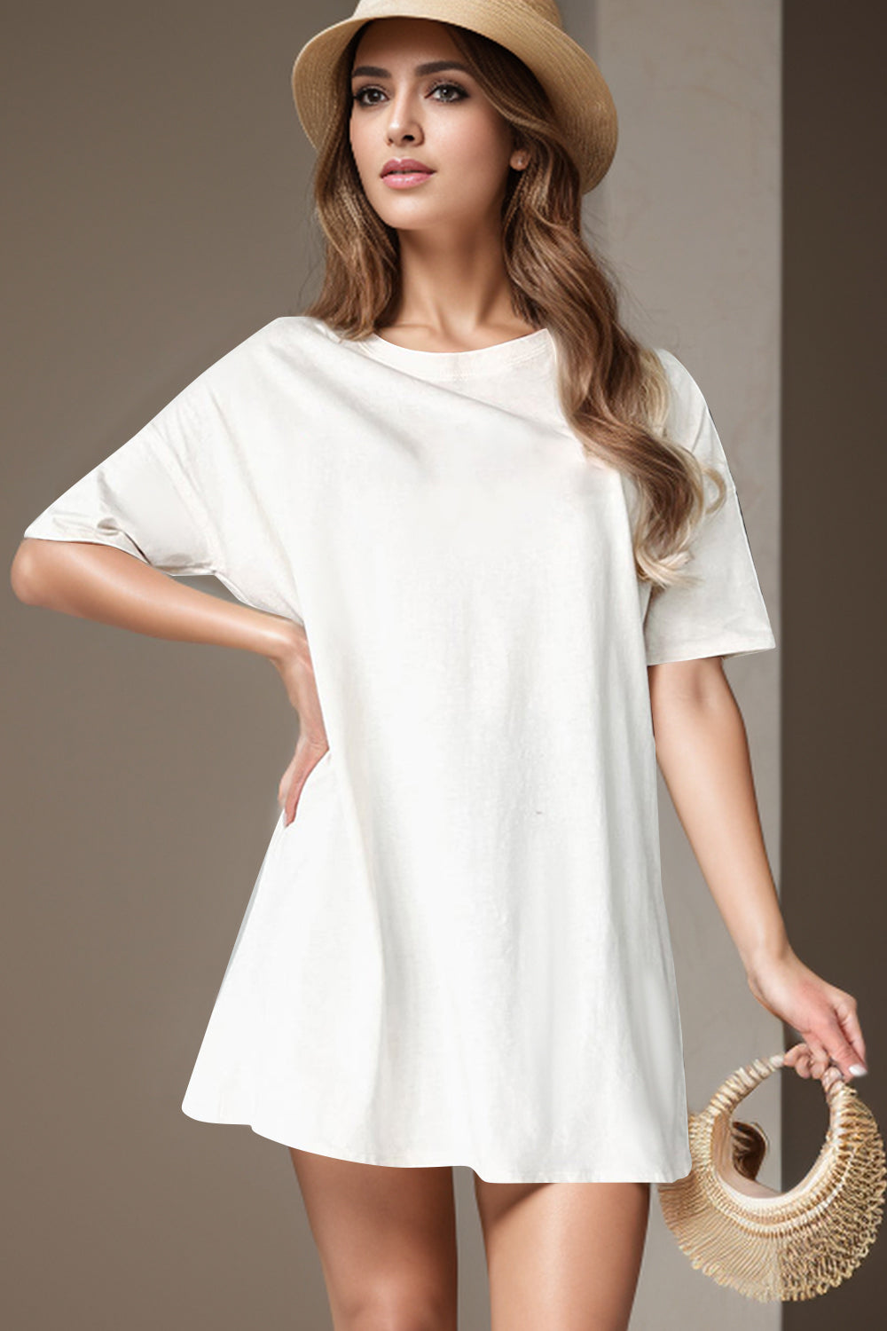 White oversized slouch tee dress with short sleeves and round neckline.