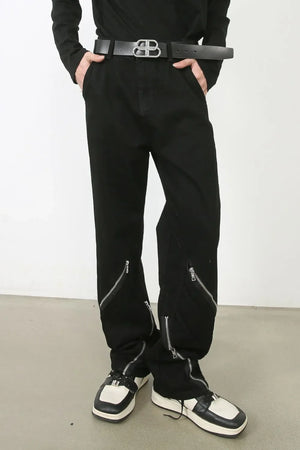 Zipped hem black denim trousers with silver zipper details.