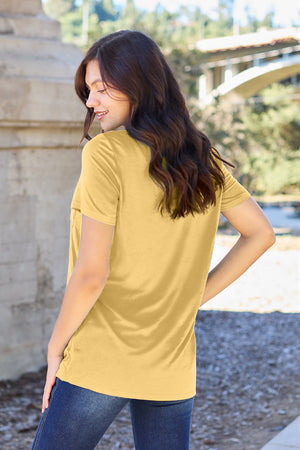 Yellow V-neck pocket tee with short sleeves and a relaxed fit.
