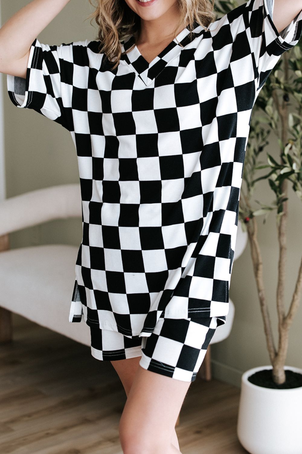 Black and white checkered v-neck t-shirt and shorts set.