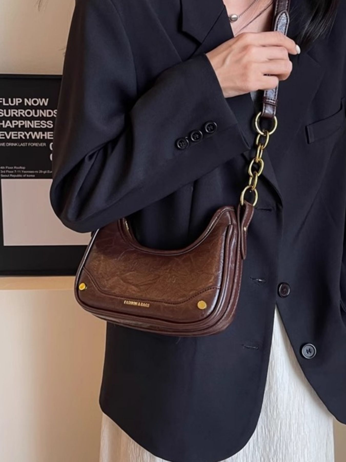 Coffee color mini shoulder bag with chunky chain accent and gold hardware.